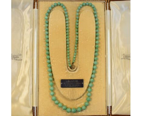 Graduated jade bead necklace in a leather case   Condition: 
