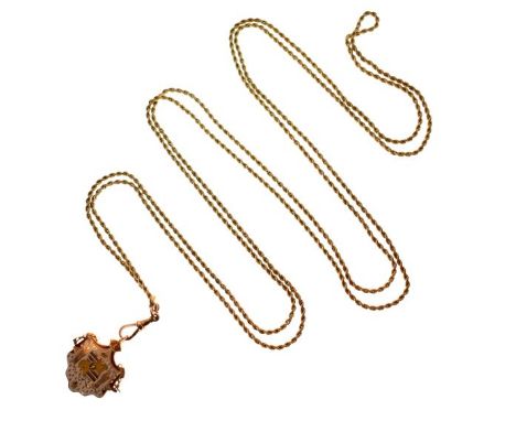 Yellow metal rope twist long guard, the swivel stamped 9ct and having an unmarked yellow metal and enamel fob brooch attached