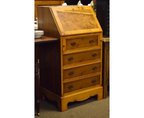 Reproduction yew wood finish bureau fitted fall flap with four drawers below and standing on bracket feet   Condition: 