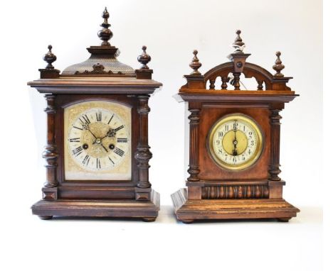 Two early 20th Century walnut and beech cased architectural style mantel clocks   Condition: 