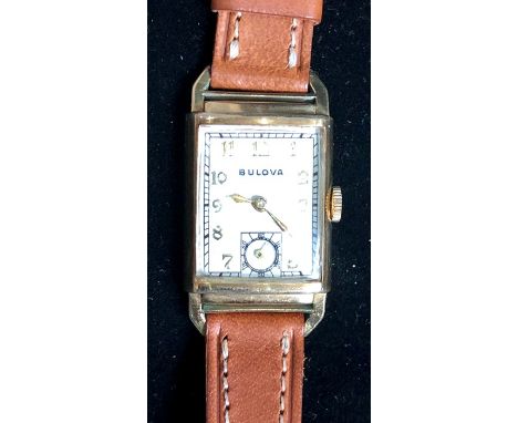 Vintage Bulova 10k gold filled gents wrist watch watch winds and ticks but no warranty given engraved back case measure appro