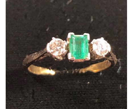 Vintage 18ct gold emerald and diamond ring ,set with central emerald and diamond either side emerald measures approx 5mm by 3