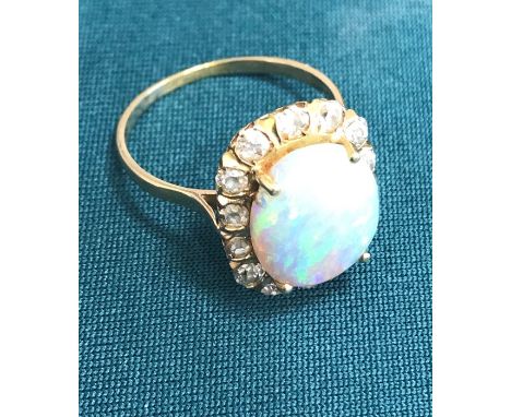 18ct Yellow gold opal and diamond cluster ring set with cluster opal surrounded by Victorian cut diamonds, large central opal