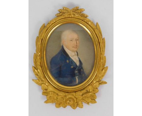 English School (early 19thC). Portrait of a gentleman in a blue jacket, half length miniature, 5.5cm x 4.5cm.