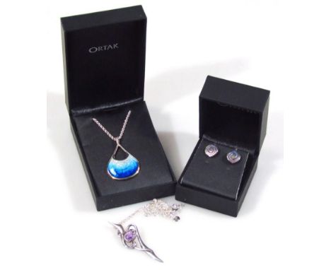 Three items of silver costume jewellery, to include an Art Nouveau style pendant set with purple stone, an Ortak silver blue 