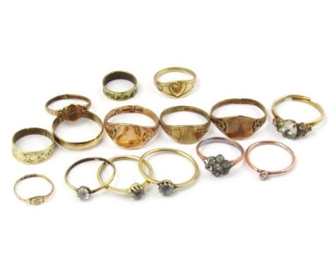 A quantity of dress rings, to include mainly gold plated examples and a claw set signet ring, with vacant cartouche, yellow m