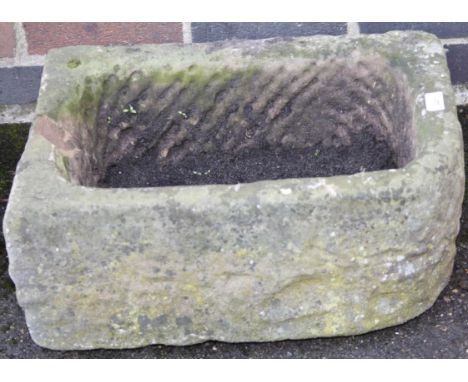 A D-end stone trough, 24cm high, 59cm wide, 46cm deep.