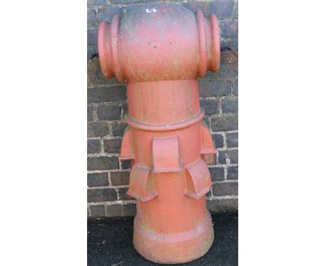 A redware vented chimney pot come planter, with cylindrical top on circular stem with flower spouts and metal fittings, 100cm