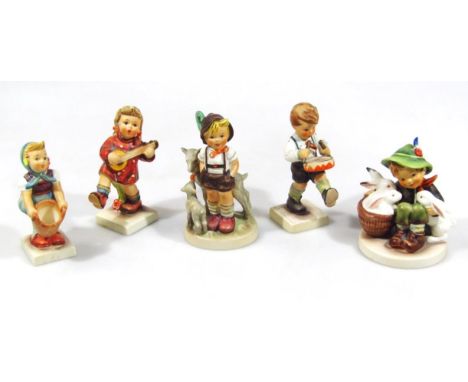 Various Goebel Hummel figures, to include boy with drum and four others. (5)