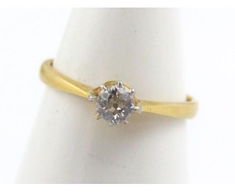 An 18ct gold diamond solitaire ring, set with single diamond, in claw setting, 2g all in.