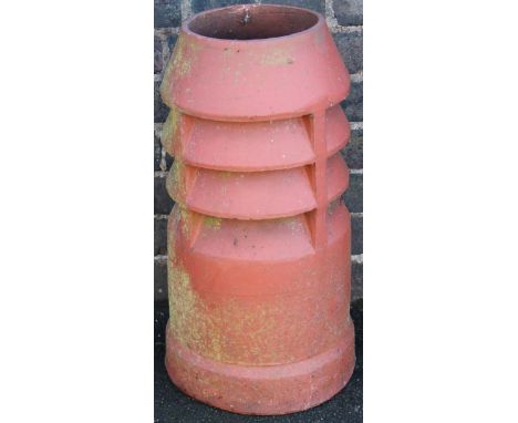 A 20thC slatted redware chimney pot planter, of circular outline, 62cm high.