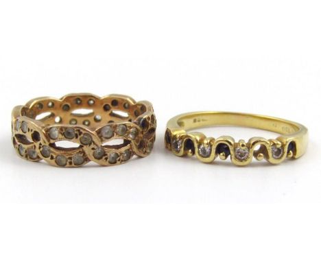 An 18ct gold band, with wavy top set with small white and blue stones, and another of shaped pierced outline, sizes K and L. 