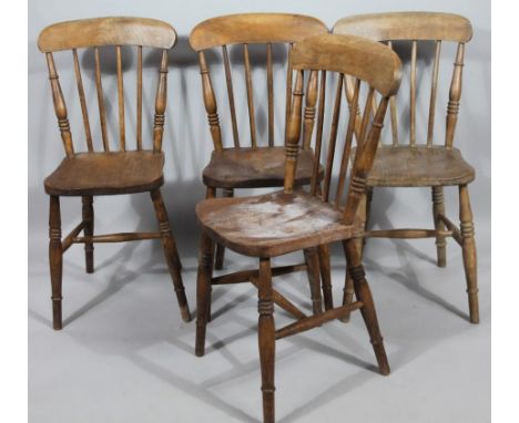 A Harlequin set of four very early 20thC ash and elm kitchen chairs, with spindle back shaped seats and triple ring turned fr