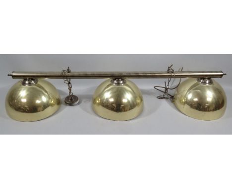 A modern brass snooker hall table light, of cylindrical outline with three shades and metal mounts, 116cm wide.