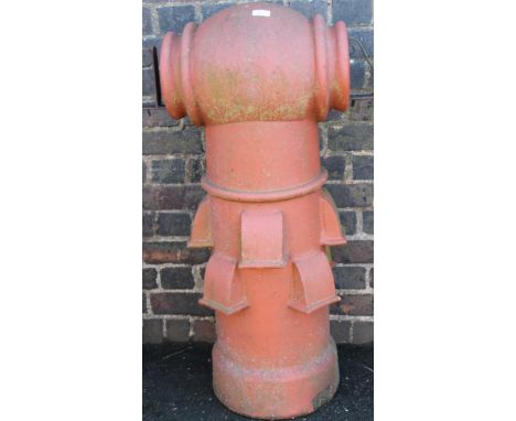 A redware vented chimney pot come planter, with cylindrical top on circular stem with flower spouts and metal fittings, 100cm