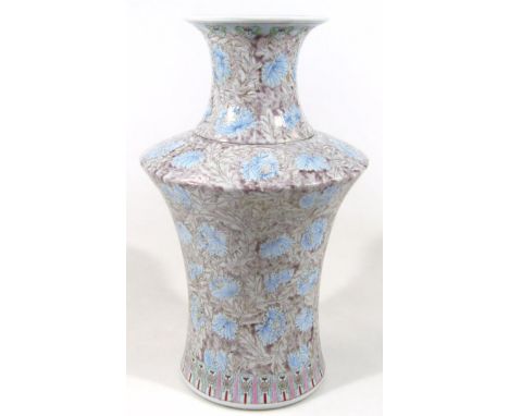 A Chinese porcelain enamel decorated vase, with inverted trumpet stem and shouldered circular body, profusely decorated with 