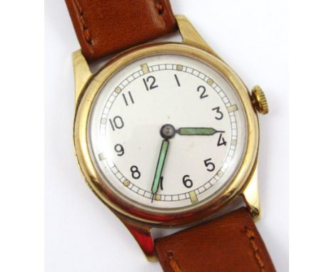 A vintage 9ct gold cased gent's wristwatch, with circular cream coloured watch head and green hands, on a tan leather strap.