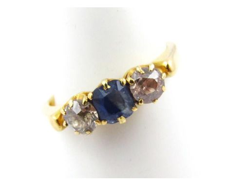 A ladies dress ring, claw set with white and blue stone, marked 18ct, size L.