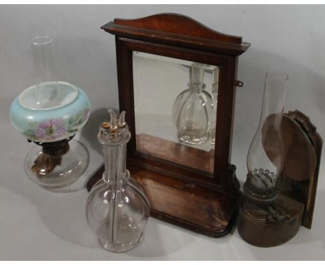 An Edwardian mahogany shaving mirror, with rectangular framework, bevel glass and shelf front, 44cm high, 40cm wide, 16cm dee