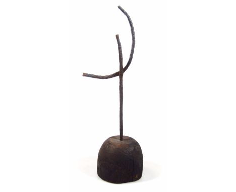 A rustic cast metal and wooden stand, the articulated slender stem raised on a domed base, possibly a light holder, 36cm high