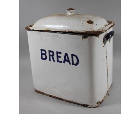 An early 20thC enamel bread bin, of shaped rectangular outline with removable lid set with blue lettering on white ground, 46