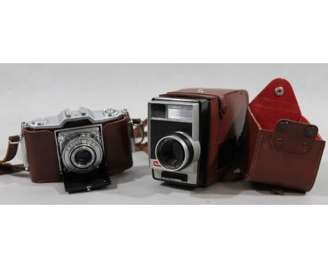 A Zeiss Contina camera, 10cm high, and a Kodak movie camera, each in brown leather cases. (2)