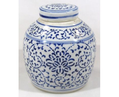 A Chinese Ming style semi-porcelain ginger jar and cover, profusely decorated with a repeat geometric scroll and flowerhead p