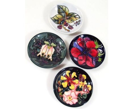 Four various Moorcroft saucers, 12cm dia. (4)