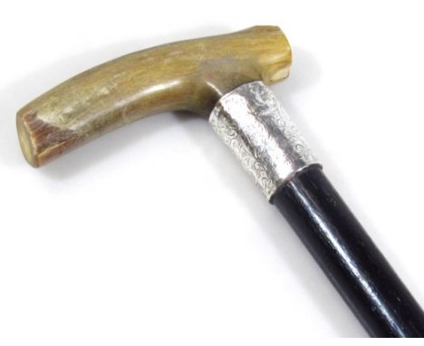 A horn silver and ebonised walking stick, of cylindrical outline with rubber end and angle top, the collar Birmingham, probab