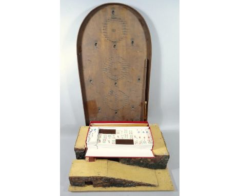 A 20thC Mahjong set, with coloured tiles in fitted card case, 7cm high, 33cm wide, 15cm deep, a wooden bagatelle, etc. (a qua