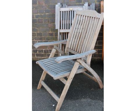 A set of four Cannock Gate slatted folding teak style garden chairs, 50cm wide.