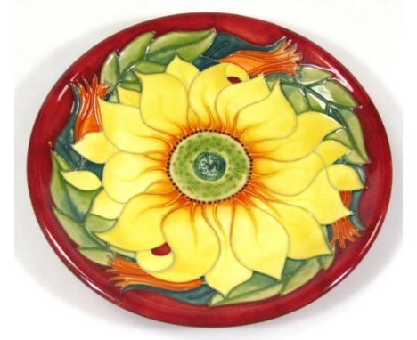 A Moorcroft Inca Sunflower pattern plate, of circular outline, numbered 94, printed and impressed marks beneath, 26cm dia. sc