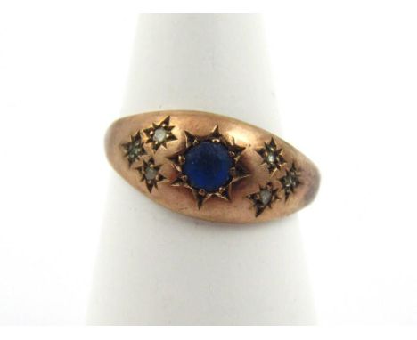 A ladies Victorian dress ring, centred by blue stone surrounded by star set small white stones, size I-J, 2g all in.