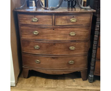 A George III mahogany bow front chest, having two short and three long drawers, 110 cm wide