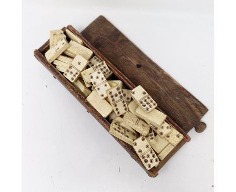 A Prisoner of War type set of bone dominoes, in a box, 22 cm