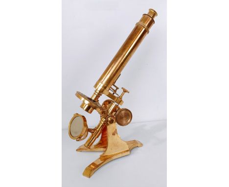 A late 19th/early 20th century brass monocular microscope, 48 cm high