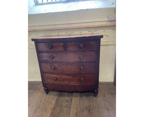 A Victorian bow front mahogany chest of drawers, 118 cm wide, a red and black lacquered bedside table, with chinoiserie style