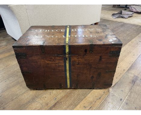 A 19th century teak and brass bound military uniform box, the top painted P Pryce Brown, Singapore, 76 cm wide