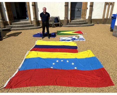 Assorted South American flags and a quantity of fur stoles (2 boxes)