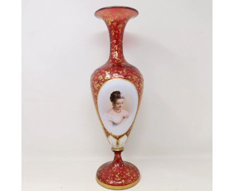 A Bohemian glass vase, glued, 37 cm high, and a glass millefiori paperweight (2)rubbing to the guilt, some very small losses 