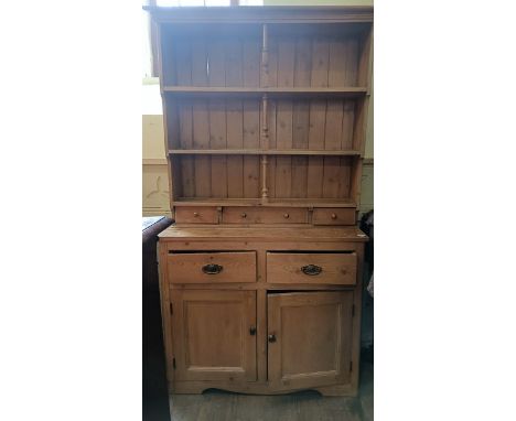 A pine kitchen dresser, 122 cm wideAn association, lacks top left hand cornice