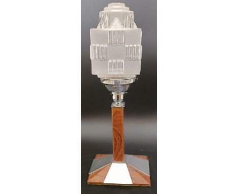 An Art Deco chrome and walnut lamp, with a glass shade, 42 cm high