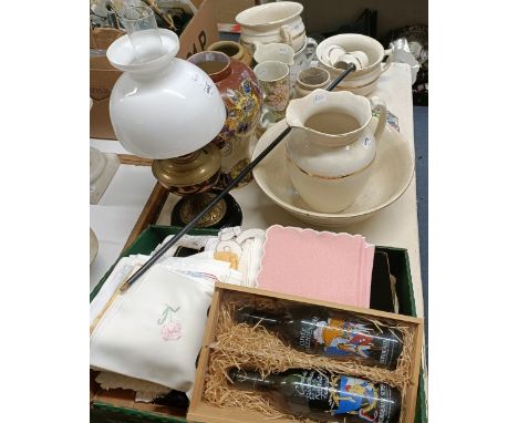 A large Royal Winton vase, 33 cm high, other ceramics, a brass table oil lamp, assorted textiles, place mats, a parasol and a