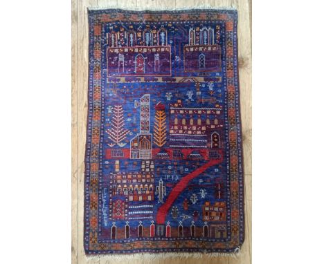 A tribal blue ground prayer mat, 144 x 66 cm