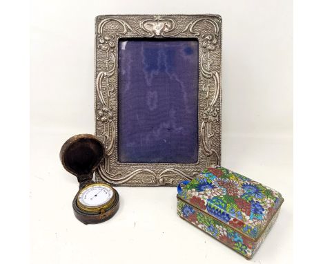 A pocket barometer, cased, a cloisonne box, 9.5 cm wide, a silver mounted photograph frame (3)