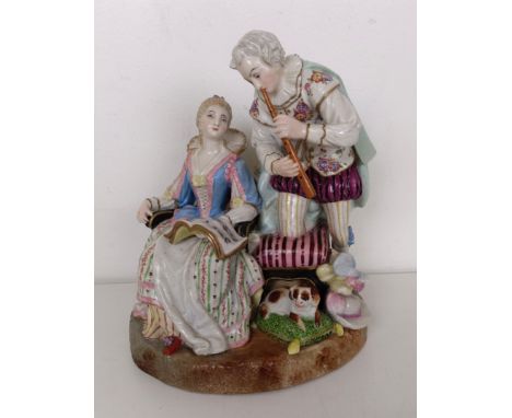 A Meissen porcelain group, with musicians and dogs, 20.5 cm highSome restoration, slight loss, there is a doll to the back wh