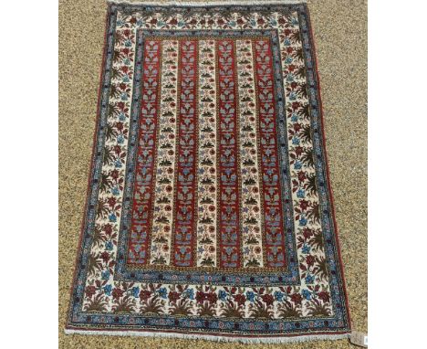 A cream ground rug, 215 x 142 cm