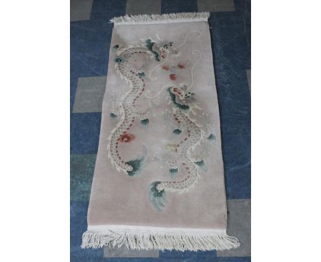 A Rectangular Chinese Patterned Rug Decorated with Dragons Chasing Flaming Pearl, 155x77cm 