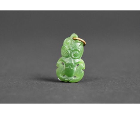 A Small Carved Jade Maori Tiki Pendant, 2cm 