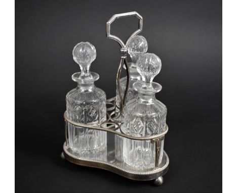 A Silver Plated and Cut Glass Three Bottle Tantalus 